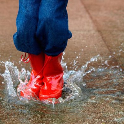 1_child-with-red-boots-jumping-in-puddle.jpg